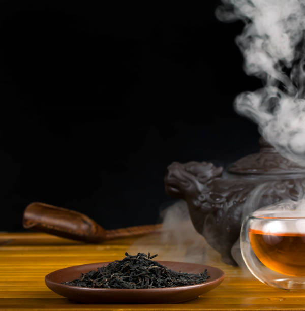 istock Clay teapot with smoked red tea Lapsang souchong 1311837530