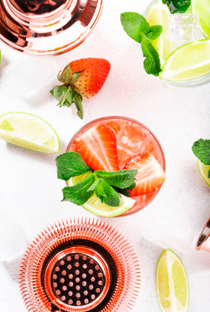 istock Mojito mocktail or cocktail with lime, mint, strawberry and ice on white background. Cold alcoholic or non-alcoholic long drinks, beverages and cocktails 1311842072