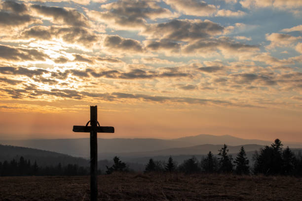 istock cross on the hill in the sunrise 1311846027