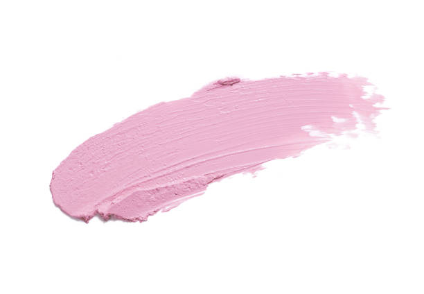 istock Glossy pink beige brown clay cream mask sample textured foundation isolated on multi-colored background 1311848430