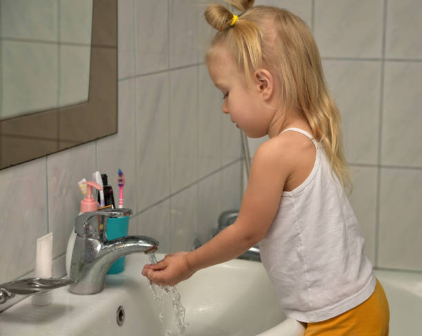 istock The child washes his hands 1311849280