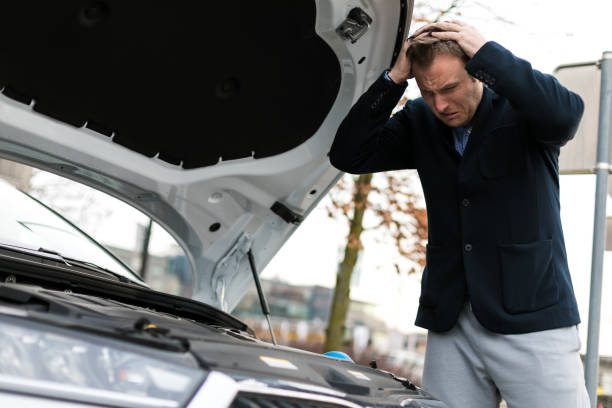 istock Buisness man reparing his car 1311852552