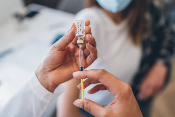 istock Preparing injection with covid-19 vaccine 1311853173