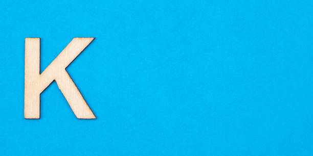 istock Letter K in white color on blue background 1311854093
