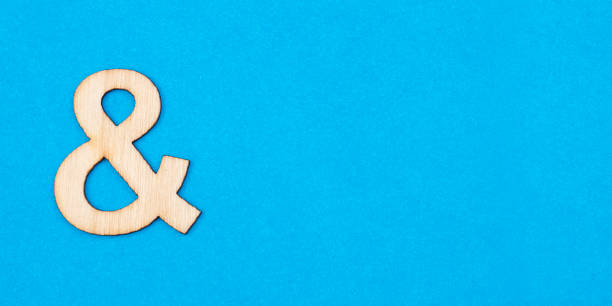 istock Letter & in white color on blue background 1311854298