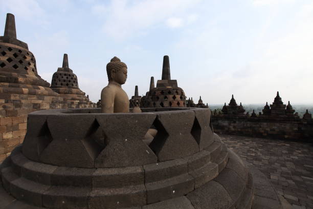 istock Buddha statue and stupas at Borobudur Temple, Central Java Indonesia 1311855158