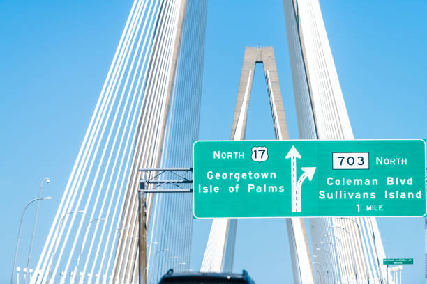 Arthur Ravenel Jr. Cooper river cable-stayed triangular arches bridge in Charleston, South Carolina with cars on road 17 with traffic cars