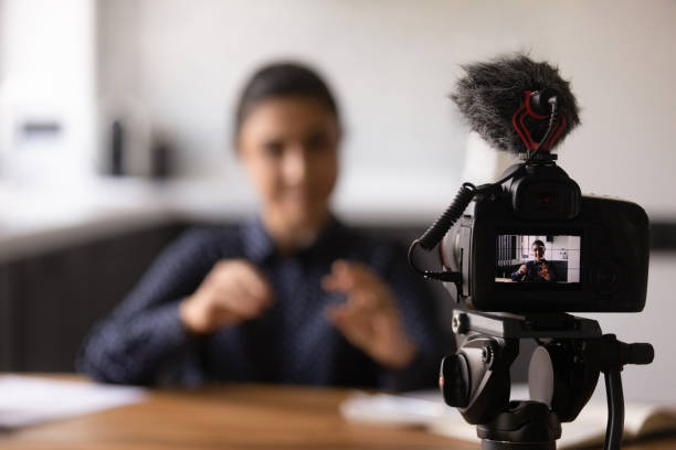 istock Close up Indian blogger using professional digital camera, recording video 1311858437