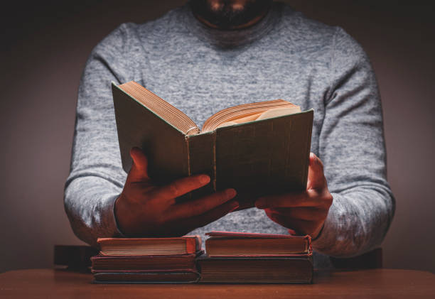 istock Man is Looking For Something in Old Books 1311859389