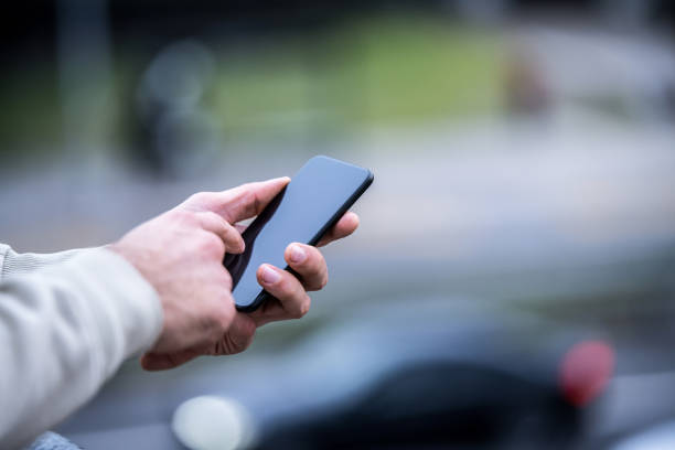 istock Young man using phone in the city. 1311862684