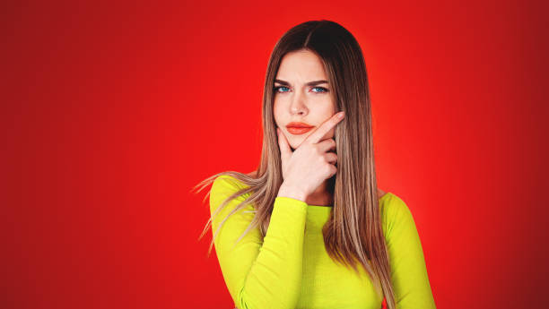 istock Lovely young woman making a wish or thinking 1311863982