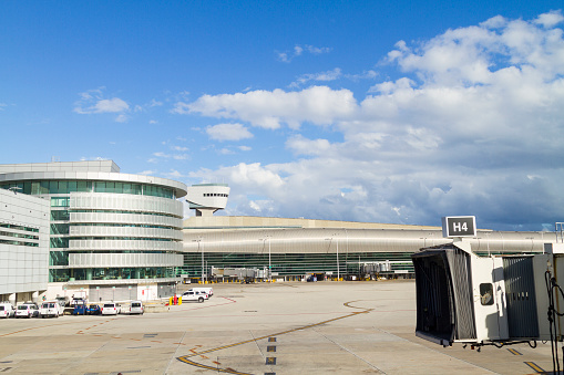 Landscape view of an empty airport outside building due to coronavirus outbreak travel restrictions. Due to the coronavirus outbreak, one of the busiest airports, Miami International airport (MIA), goes emptiness, on 27 December 2020.