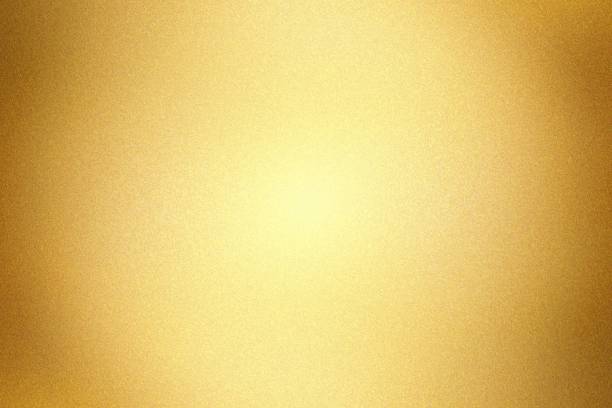 istock Glowing gold painted metal wall with copy space, abstract texture background 1311871189