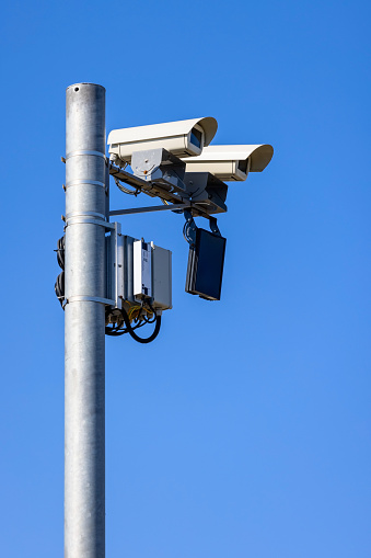 CCTV, Security road camera for traffic control on the street on blue sky