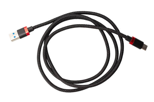 istock Black USB type C charger cable, compatible for many devices, wrapped in a spiral shape, isolated on white background. 1311891083