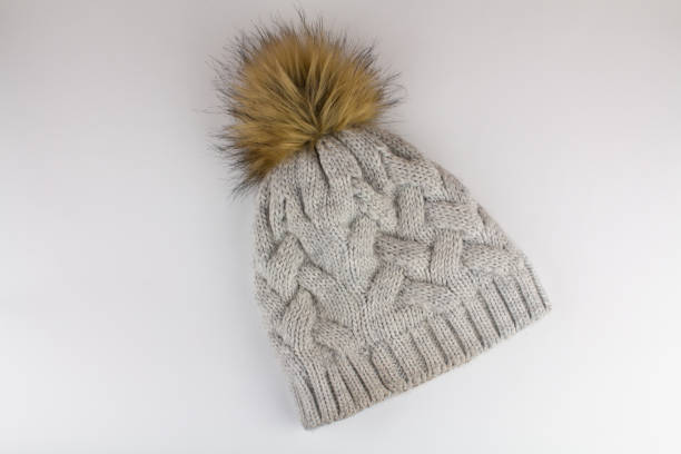 istock beautiful knitted winter hat on a white background 1311891095