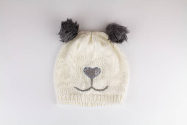 istock beautiful knitted winter hat on a white background 1311891105