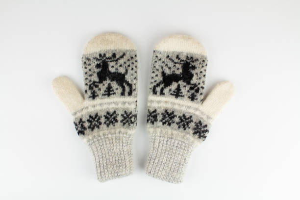 istock women's winter knitted mittens on a white background 1311891132