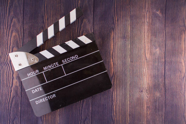 istock Clapperboard lies on a wooden a background 1311891373