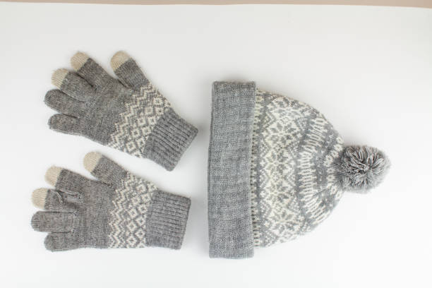 istock women's winter knitted mittens with a hat on a white background 1311891416