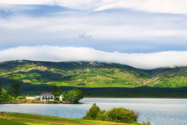 Lake in the mountains in early spring. Beautiful landscape in South Ural, Russia.