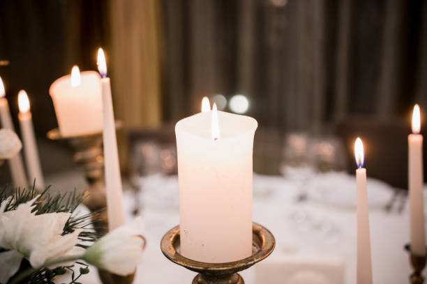 istock white candles burn on a table in a restaurant 1311892046