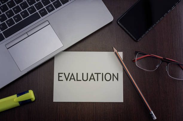 istock Evaluation card. Top view of office table desktop 1311897694