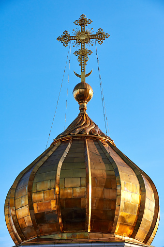 Close-up of golden roof on Christ the Saviour Cathedral in blue sky, Moscow, Russia.