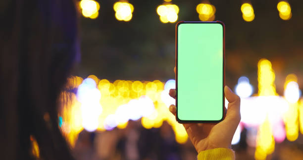 istock female use phone outdoors 1311899908