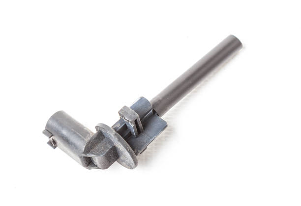 istock The coolant level sensor is black on a white background with metal elements, it is installed on the expansion tank or washer tank. 1311902816