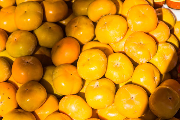 istock orange fruit stacked on the market thailand. 1311906125
