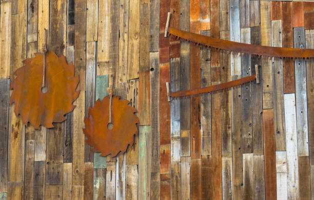 old rusty circular saw hanging on wooden wall. - wood circular saw dirty old imagens e fotografias de stock