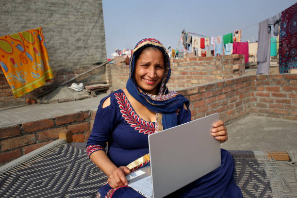 istock Rural woman using laptop at home 1311908306