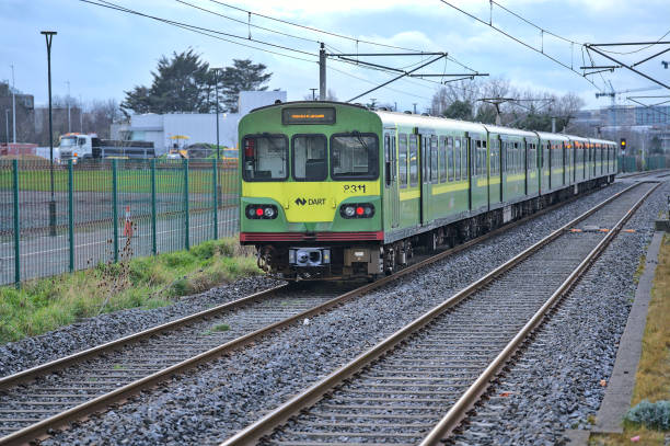 Distant view of entire DART train in action at Blackrock train station stock photo
