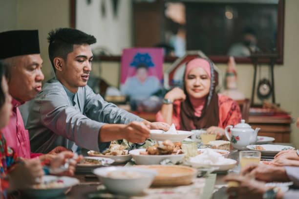 istock Iftar Ramadan hari raya malaysian muslim multi generation family enjoying dinner at home in dining room 1311912115