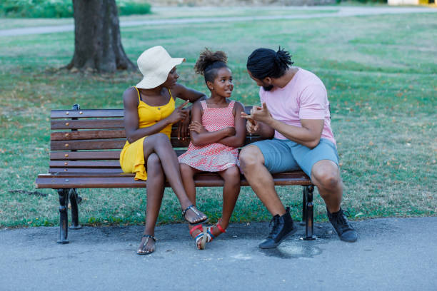 istock An African Family is Talking About the Problems in Public Park. 1311912329