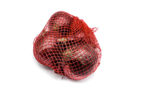 istock red onion in net isolated on white background 1311916502