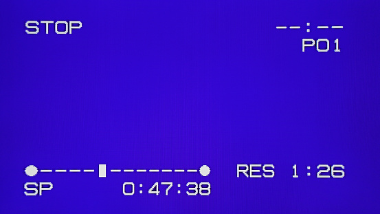 Real Analog VHS blue screen with stop and rew actions. TV effects and artifacts. VHS. . Retro 80s, 90s
