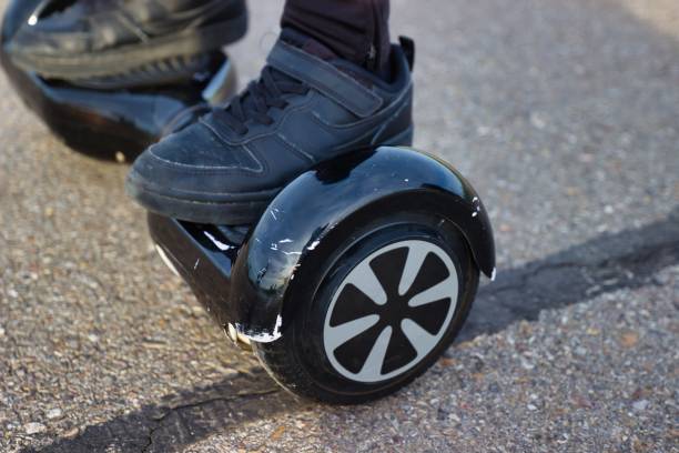 boy on a hoverboard boy on a hoverboard hoverboard stock pictures, royalty-free photos & images