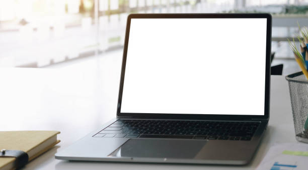 istock Blank screen Laptop computer and poster workspace background in modern office 1311925442