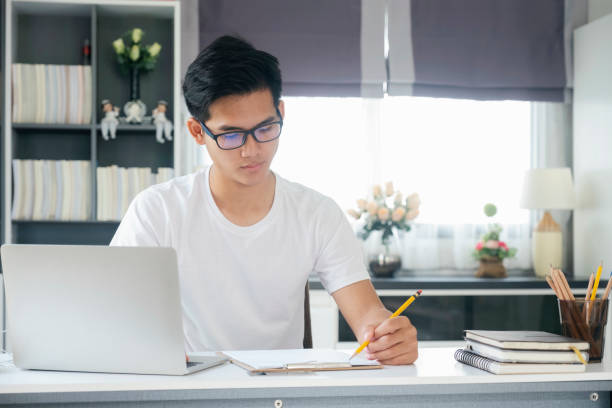 istock Young man working and learning online at home. 1311928615