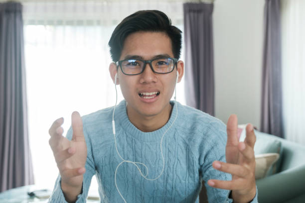 istock Young man online video conference at his house. 1311928629