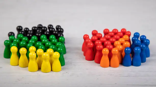 wooden figurines in the colors of German political parties, Green Party, FDP and Christian Democratic Union as government coalition and other parties as opposition