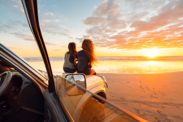 istock Sitting on car enjoying beauty after surfing. 1311930657