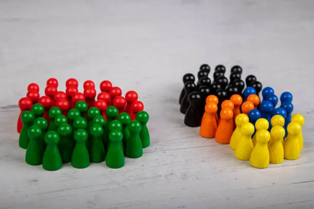 wooden figurines in the colors of German political parties, Green Party and SPD as government coalition and other parties as opposition