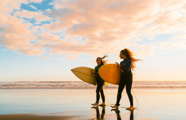 istock Surfers with surf boats. 1311930665