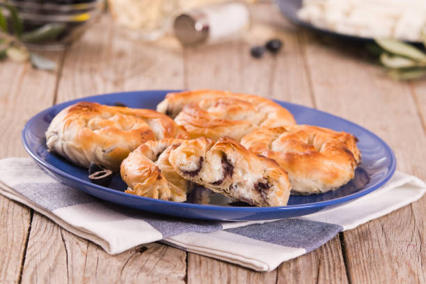 istock Pastry swirls with cheese and olive filling. 1311930668