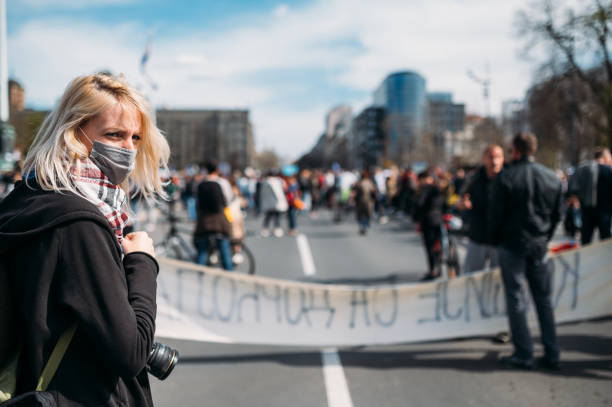 istock Female photographer joined the protest 1311930671