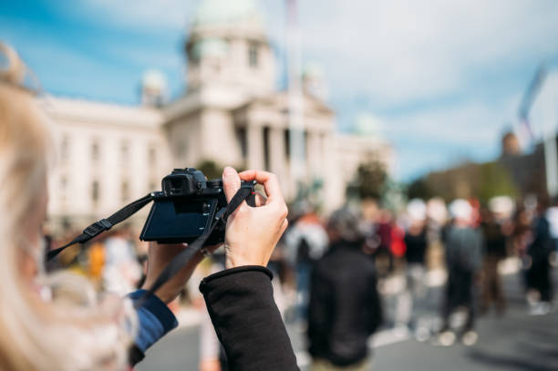 istock Female photographing the protest 1311930673
