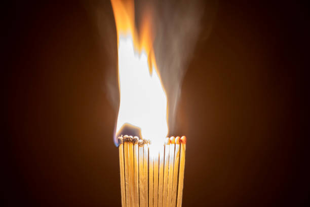 istock close up of burning matches against dark background 1311930771